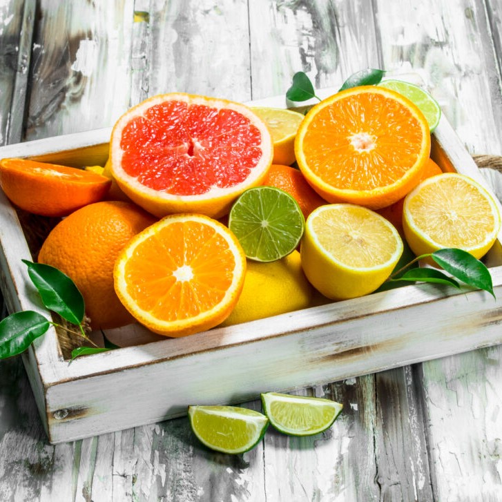 Fresh citrus in tray.